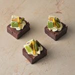 Salted caramel brownie, pistachio, nougat, passionfruit cream