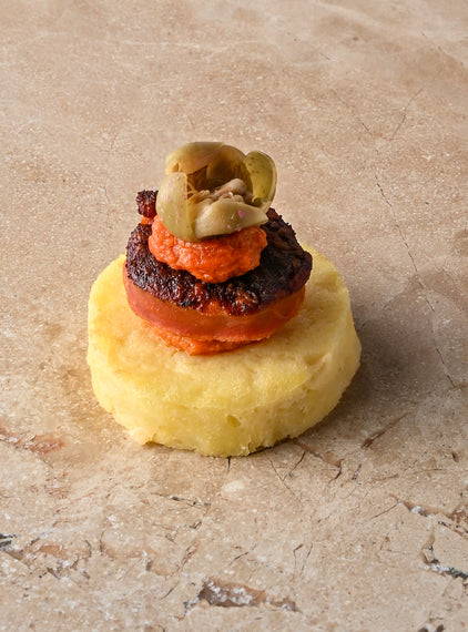 Seared chorizo, tortilla, oregano and tomato puree, caper flower