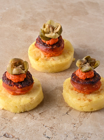 Seared chorizo, tortilla, oregano and tomato puree, caper flower