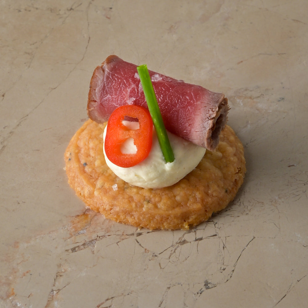 Seared carpaccio sirloin of beef, Dijon mustard crème, fresh chilli, chive, shortbread (GF)