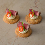 Seared carpaccio sirloin of beef, Dijon mustard crème, fresh chilli, chive, shortbread (GF)