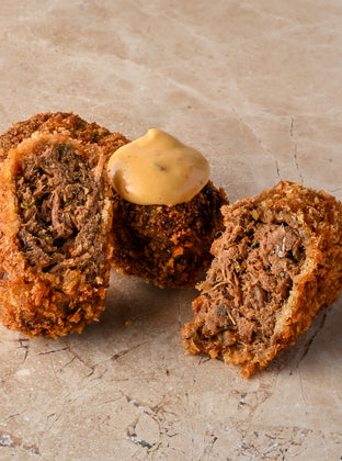 Spiced beef brisket and roasted onion croquette, chipotle, mustard mayo