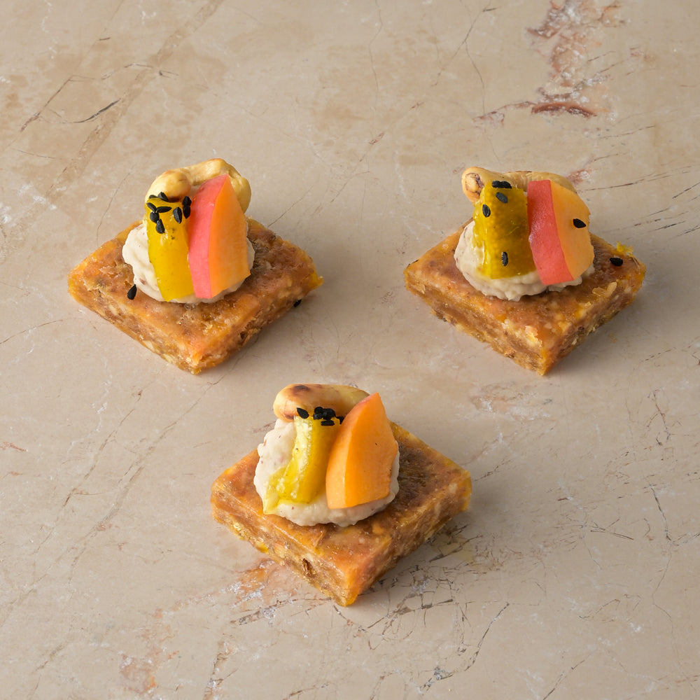 Spiced savoury date fudge, pink pepper bean puree, lime pickle, cashew, fresh apricot (GF)