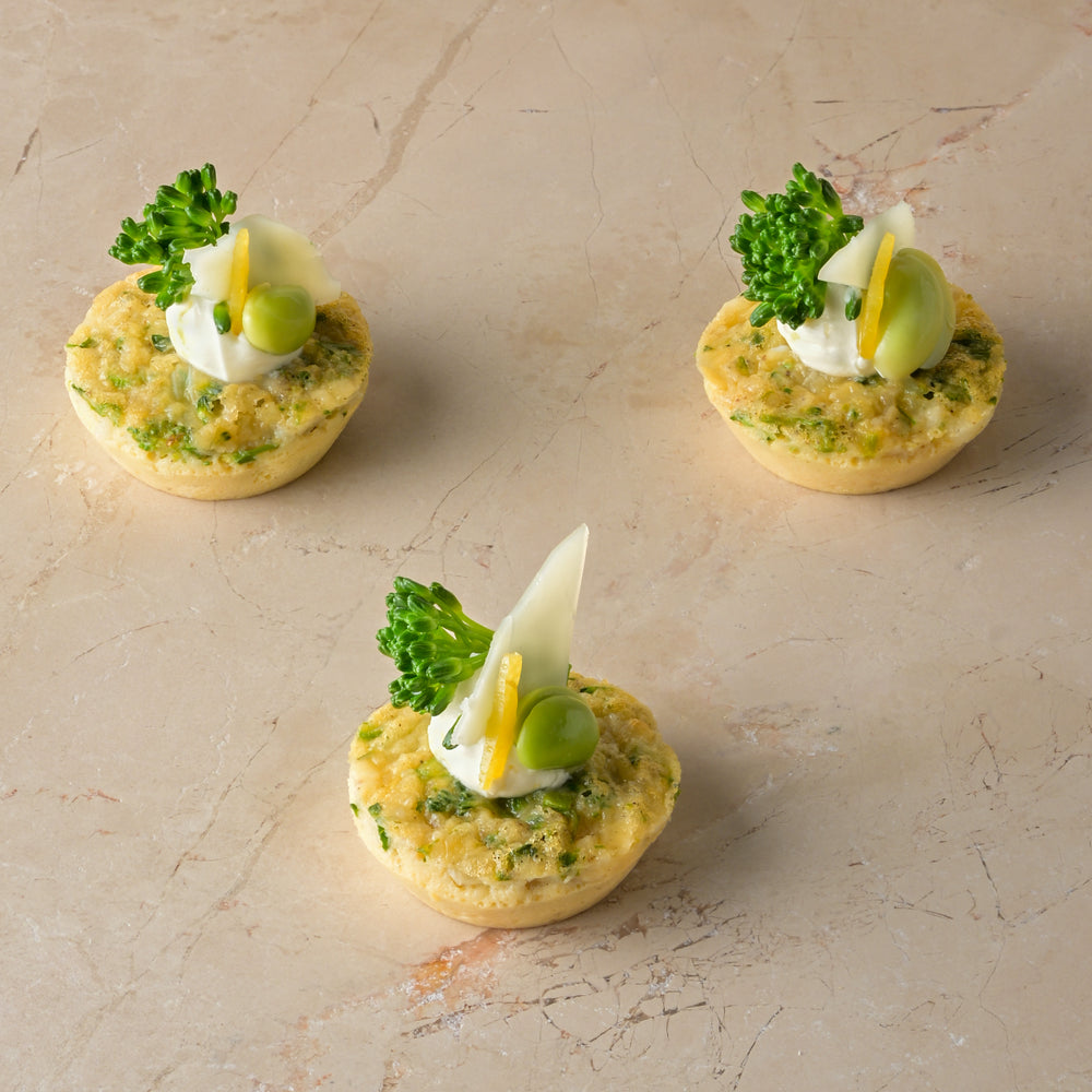 Tenderstem, Grana Padano and roast shallot frittata, lemon crème, tenderstem tip, broad bean (GF)