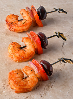 Valencian fire spiced prawns, red pepper, pink onion black olive