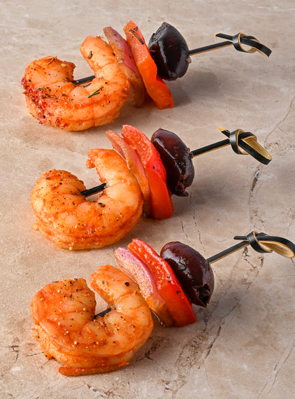 Valencian fire spiced prawns, red pepper, pink onion black olive