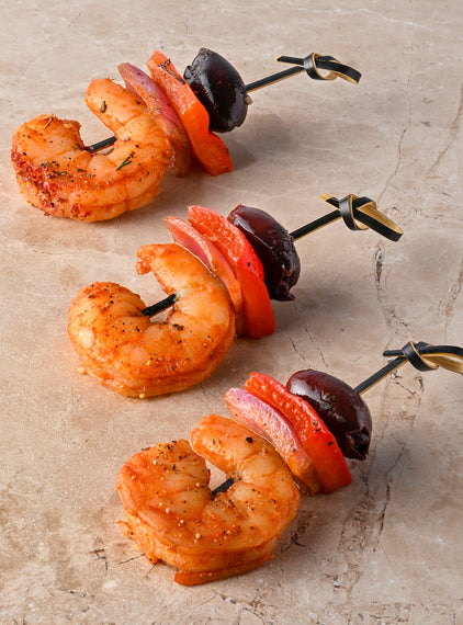 Valencian fire spiced prawns, red pepper, pink onion black olive