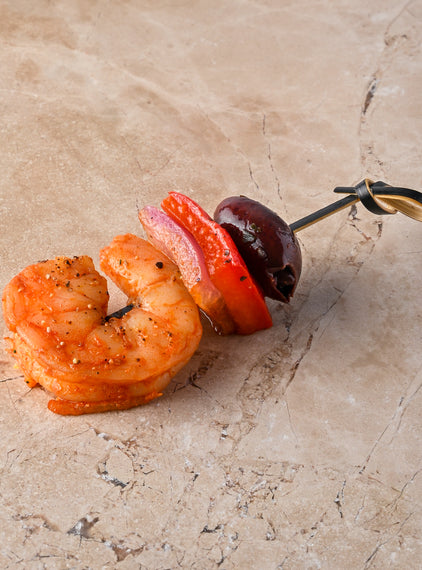 Valencian fire spiced prawns, red pepper, pink onion black olive