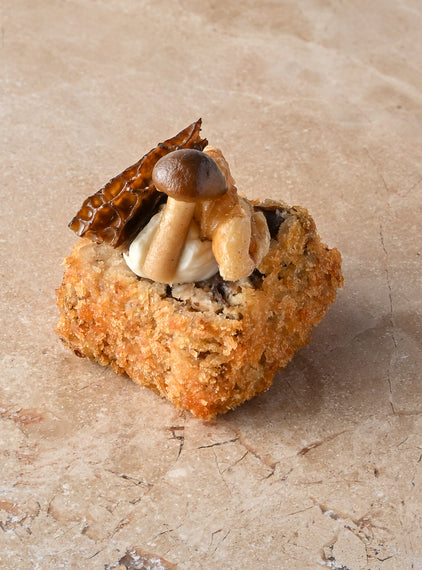 Wild mushroom arancini, truffled creme, walnut