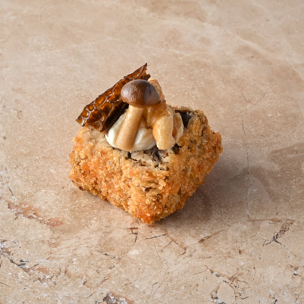 Wild mushroom arancini, truffled creme, walnut