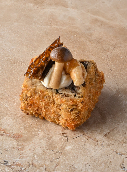 Wild mushroom arancini, truffled creme, walnut