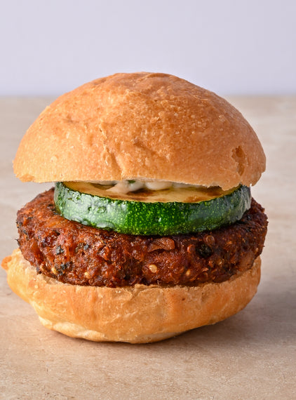 Quinoa and coriander falafel burger, fried courgette, tahini lime aioli, fresh mint leaf
