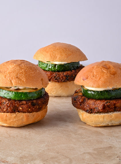 Quinoa and coriander falafel burger, fried courgette, tahini lime aioli, fresh mint leaf