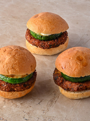 Quinoa and coriander falafel burger, fried courgette, tahini lime aioli, fresh mint leaf