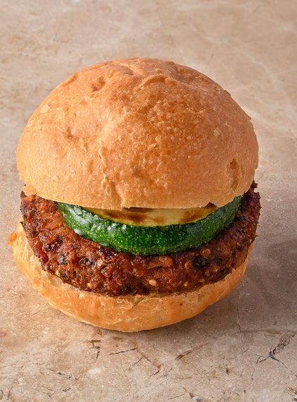 Quinoa and coriander falafel burger, fried courgette, tahini lime aioli, fresh mint leaf