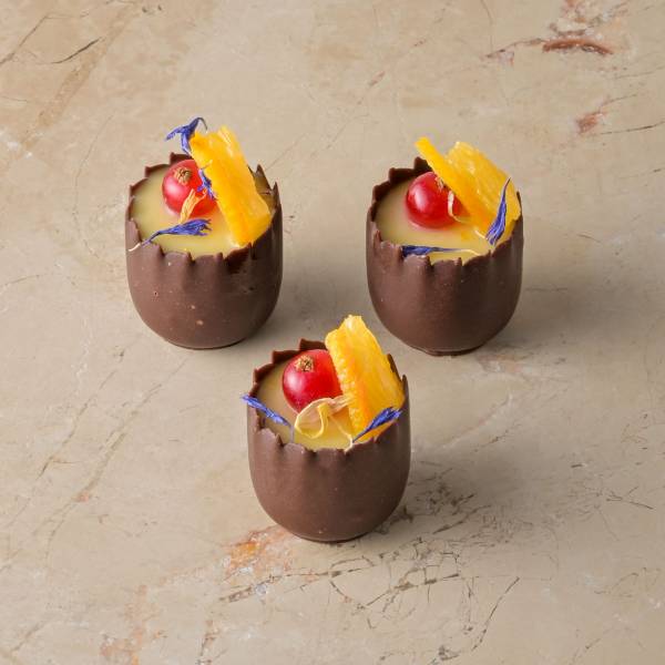 Orange cardamom posset, chocolate cup, red current, fresh orange, zest - Image 2